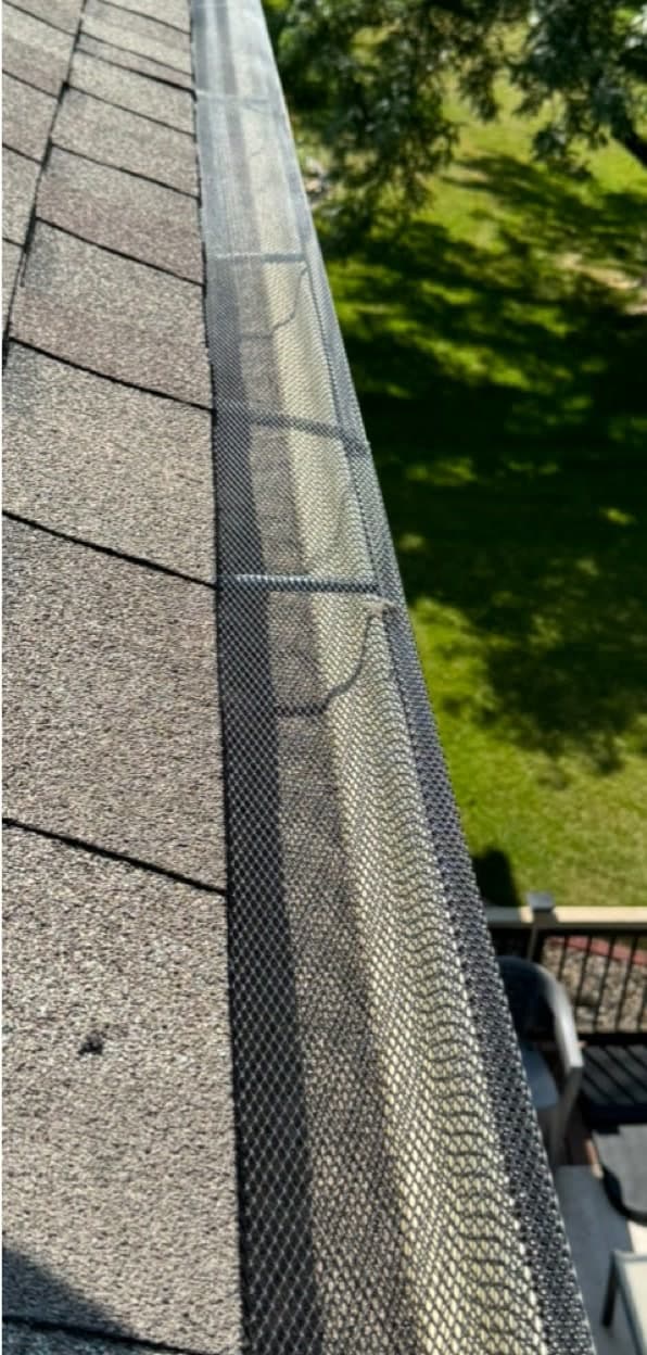 The same gutter line cleaned and fitted with a gutter guard